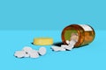 White pills spilling out of pill bottle isolated on blue background. 3d illustration Royalty Free Stock Photo