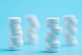 White pills or tablets stacked on each other in different positions Royalty Free Stock Photo