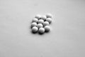 White pills on white with blur effect in black and white Royalty Free Stock Photo