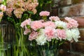 white and pink carnations close bouquet on showcase