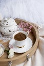 White and pink flowers. Breakfast in bed. Flavored coffee. Delicate light colors. Romance. Place for text.