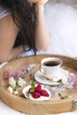 White and pink flowers. Breakfast in bed.Happy woman. Flavored coffee. Delicate light colors. Romance. Place for text. copy space Royalty Free Stock Photo