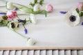 White and pink flowers on white wood