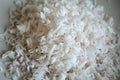 White and pink natural coconut flakes