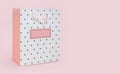 White pink with polka dot package bag for shopping or gift on pink background Royalty Free Stock Photo
