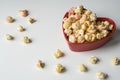 White pink popcorn in heart shape bowl Royalty Free Stock Photo