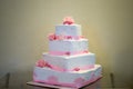 White and pink square storey wedding cake