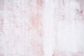 White and pink textured concrete wall with subtle scratch patterns and weathered Royalty Free Stock Photo