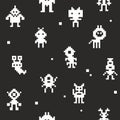 White pixel monsters on black background. Royalty Free Stock Photo