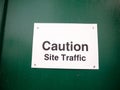 White placard warning caution site traffic construction