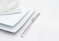 White place setting with knife and folded napkin