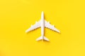 White plane, airplane on yellow color background with copy space. Top view, flat lay. Minimal style design. Travel, vacation Royalty Free Stock Photo