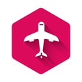 White Plane icon isolated with long shadow. Flying airplane icon. Airliner sign. Pink hexagon button. Vector