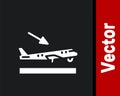 White Plane landing icon isolated on black background. Airplane transport symbol. Vector Royalty Free Stock Photo