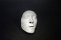 White plaster cast of a person on black background Royalty Free Stock Photo