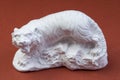 White plaster figurine figurine of a toy tiger Royalty Free Stock Photo