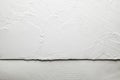 White plaster on the wall and handmade paper sheet background Royalty Free Stock Photo