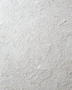 White plaster wall texture surface showing rough bumpy stucco finish as abstract architectural background Royalty Free Stock Photo