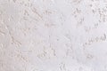 White plastered wall background with abstract pattern, close-up, macro. Royalty Free Stock Photo
