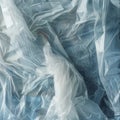 A white plastic bag is stretched out on a blue surface Royalty Free Stock Photo