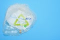 White plastic on a blue background. Plastic pollution. Recycling plastic, reusable packing, sorting garbage concept. Zero waste,