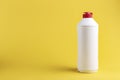 white plastic bottle with detergent without label on a yellow background. Royalty Free Stock Photo
