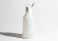 A white plastic bottle with a flip top cap isolated on white background Royalty Free Stock Photo