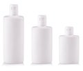 White Plastic bottles with soap or shampoo without label reflected on white background Royalty Free Stock Photo