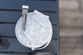 White plastic bucket with ice cubes and tongs Royalty Free Stock Photo