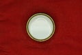 white plastic button on red clothing fabric Royalty Free Stock Photo