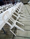 Plastic chairs resting on the tables Royalty Free Stock Photo