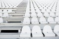 White plastic chairs in rows Royalty Free Stock Photo