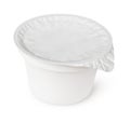 White plastic container for dairy foods with foil lid Royalty Free Stock Photo