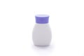 White plastic cosmetic bottle with purple cap for lotion etc  isolated on the white background Royalty Free Stock Photo