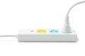 White plastic electrical multiple sockets with connected plugs on a white background Royalty Free Stock Photo