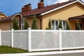 White plastic fence in a modern cottage village