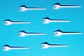 White plastic forks on blue background Royalty Free Stock Photo