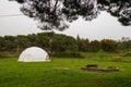 White plastic geodesic dome in a green field. Modern ball structure ball shaped Royalty Free Stock Photo
