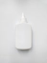 White plastic glue bottle on white background