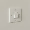 A white plastic light switch is mounted on a pale wall. The switch plate is rectangular Royalty Free Stock Photo