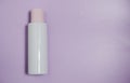 White plastic mock-up of a bottle of cosmetic lotion  peeling  cream with a pink cap on a blue background. Top view with a copy of Royalty Free Stock Photo