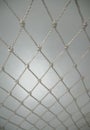 White Plastic Nylon Net From Rope on White Background. Polypropylene Twisted Rope Net