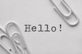 White plastic paper clips with Hello word Royalty Free Stock Photo