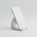 White plastic phone stand with a minimalist design. The stand features a triangular Royalty Free Stock Photo