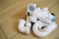 White plastic plumbing, plumbing pipes, smooth and curved, fittings, flanges, rubber gaskets Royalty Free Stock Photo