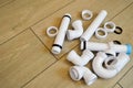 White plastic plumbing, plumbing pipes, smooth and curved, fittings, flanges, rubber gaskets Royalty Free Stock Photo