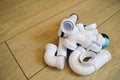 White plastic plumbing, plumbing pipes, smooth and curved, fittings, flanges, rubber gaskets. Royalty Free Stock Photo