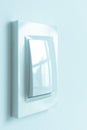A white plastic power switch in an apartment on a white wall Royalty Free Stock Photo