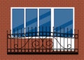 White plastic pvc window with door and balcony with black metal balcony rail, front view. isolated on a red brown brick wall