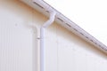 White plastic rain guttering system. Guttering drainage pipe exterior. Royalty Free Stock Photo